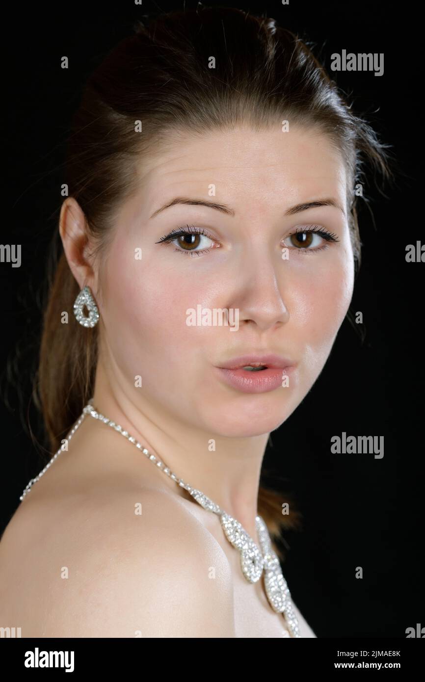 Portrait of the girl Lips with a straw on a black background Stock Photo