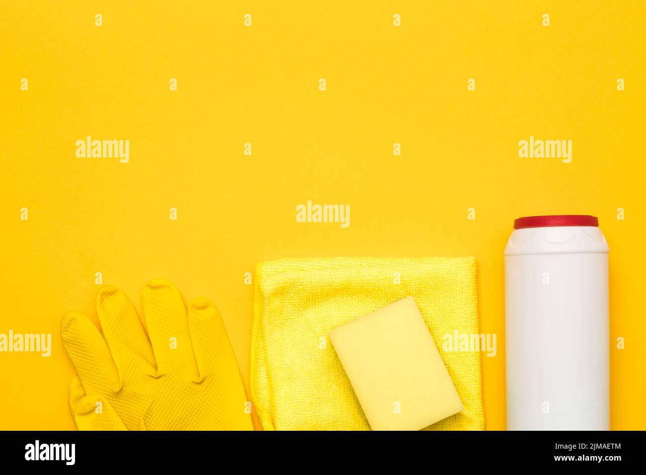 home cleaning supplies row yellow copy space Stock Photo