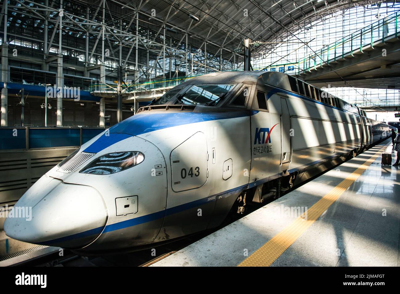 High-speed bullet trains (KTX) and Korail trains stop at the Seoul station in South Korea. Stock Photo