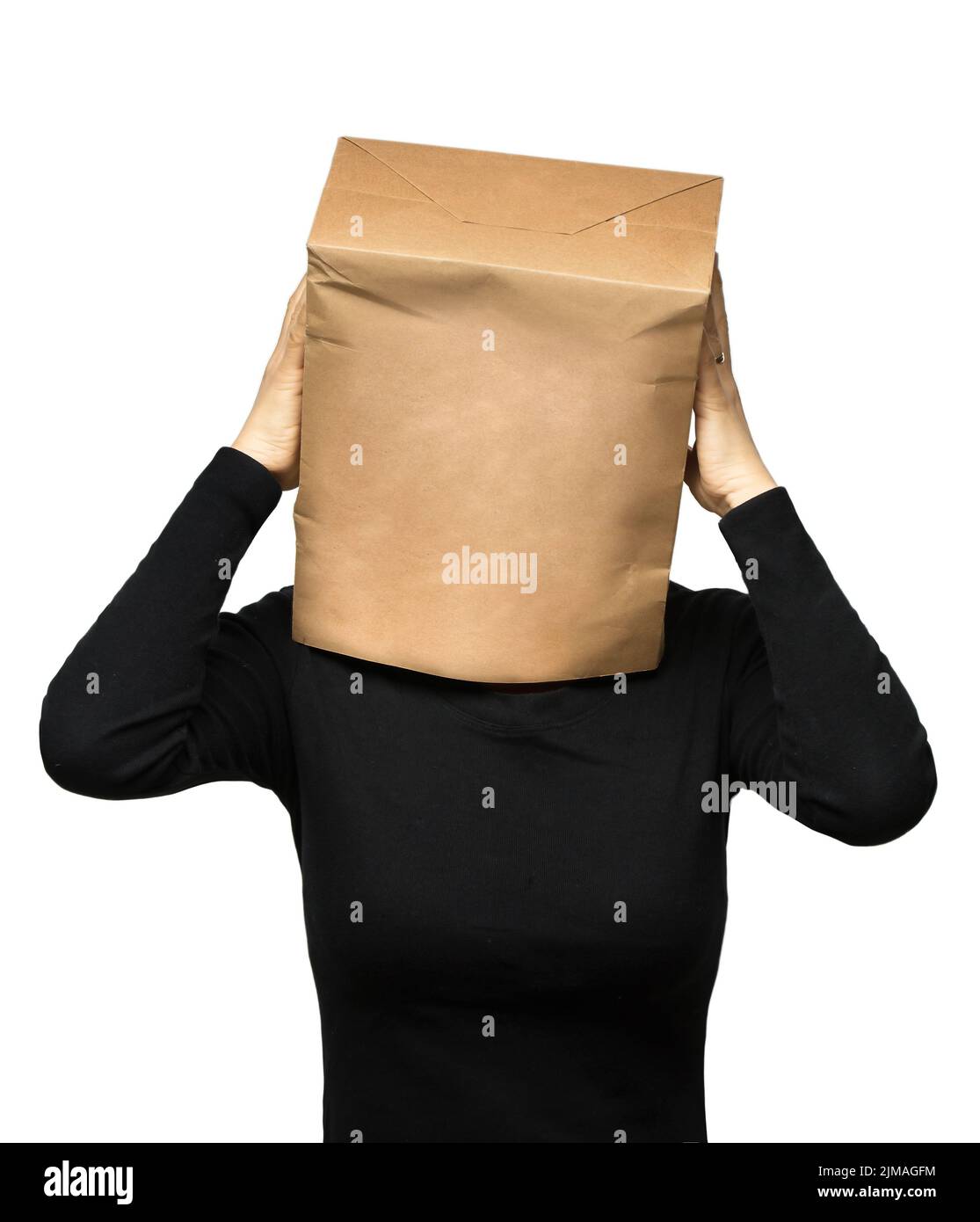 Young woman covering his head using a paper bag. woman worries Stock Photo