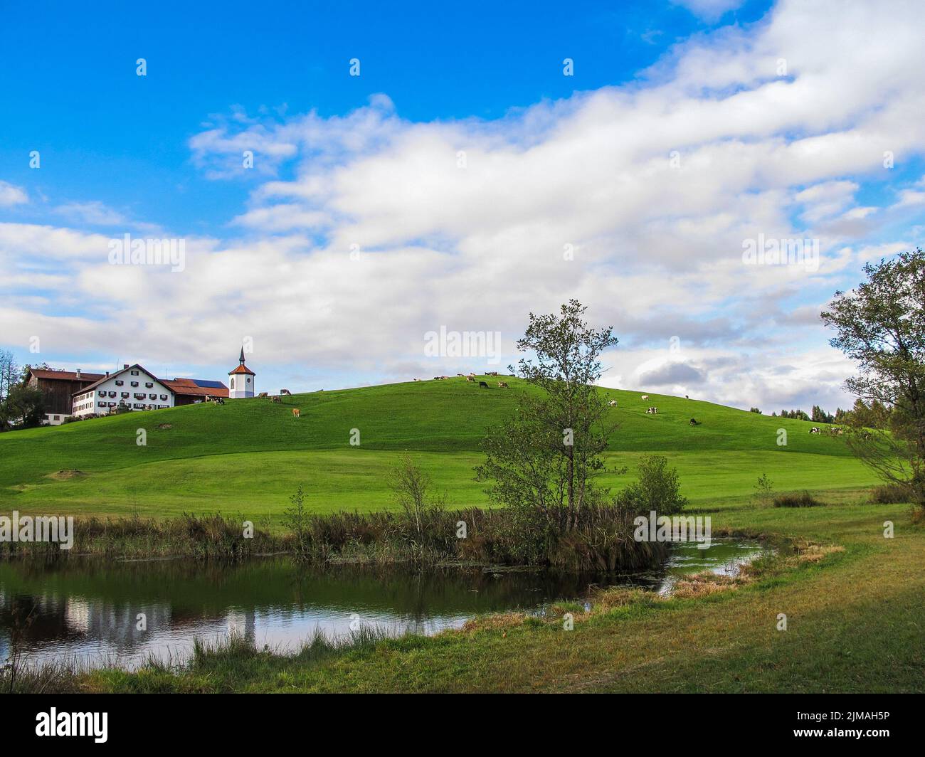 Landscape in Bavaria - Lake Hegratsriedersee with little Chapel - AllgÃ¤u Stock Photo