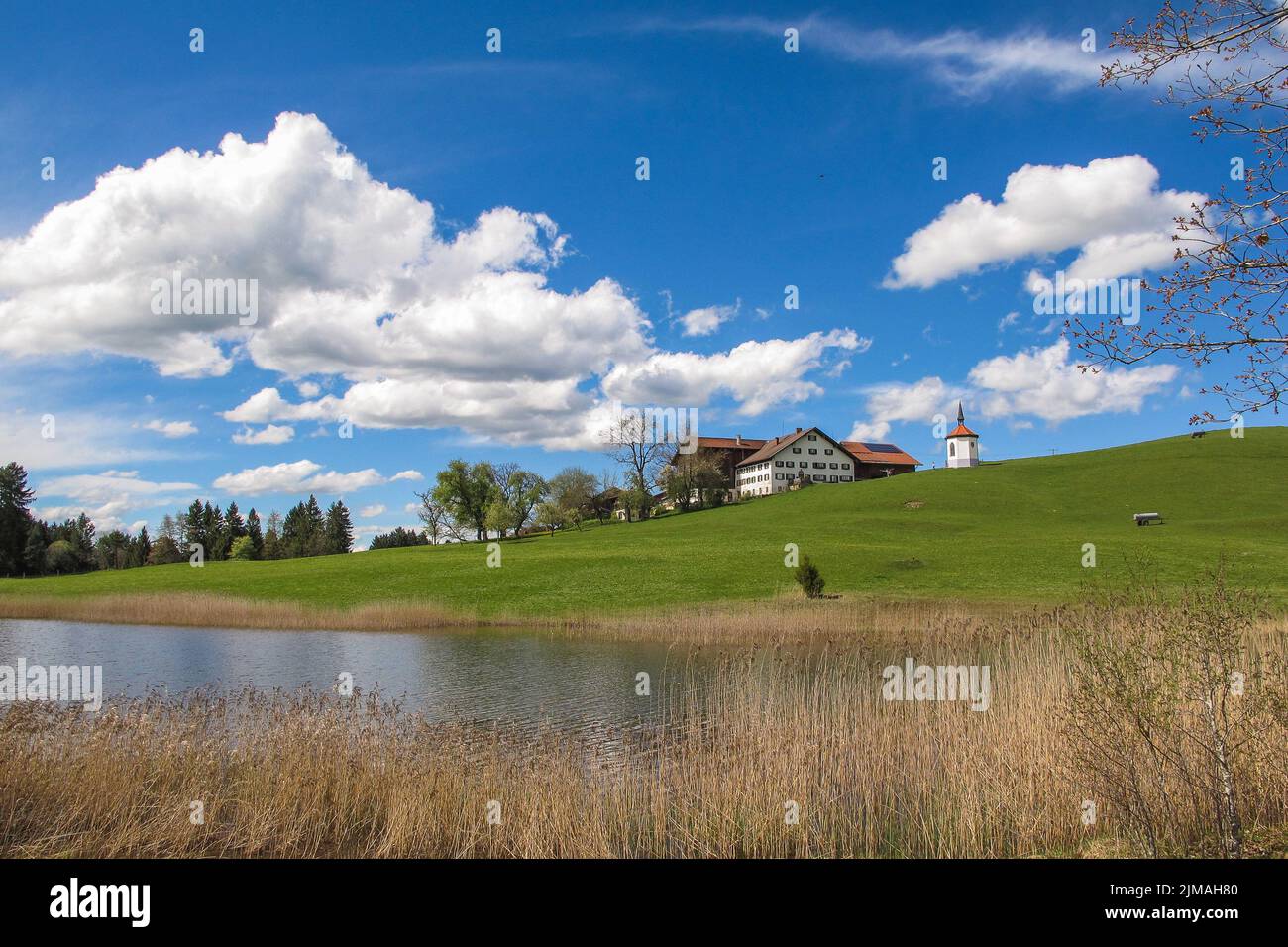 Landscape in Bavaria - Lake Hegratsriedersee with little Chapel - AllgÃ¤u Stock Photo