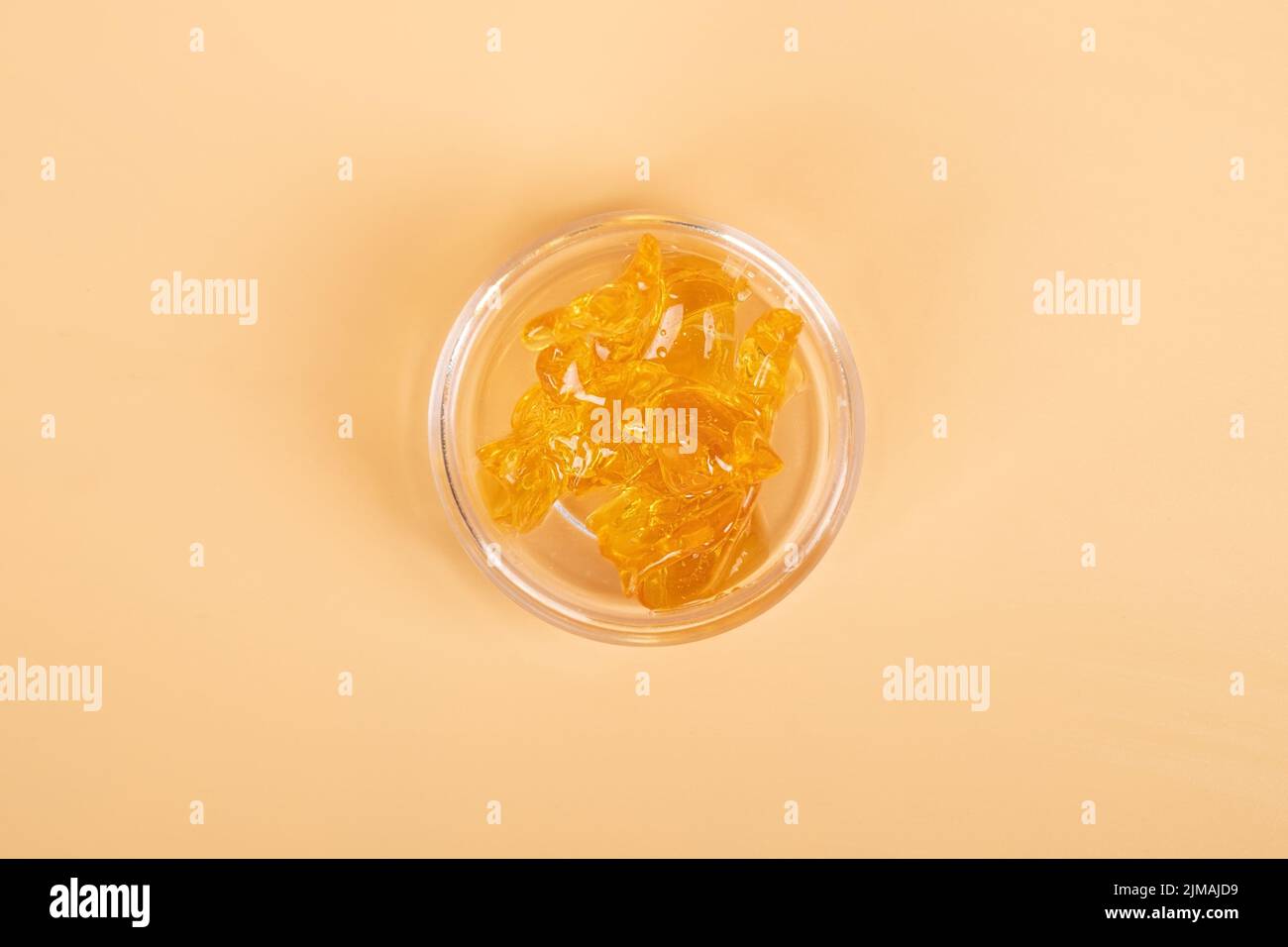 golden cannabis resin concentrate, wax with high thc. Stock Photo