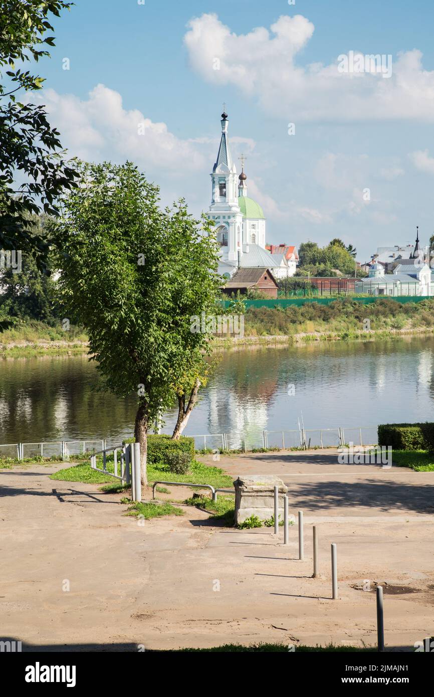 River and orthodox church on the beach on a summer day Stock Photo