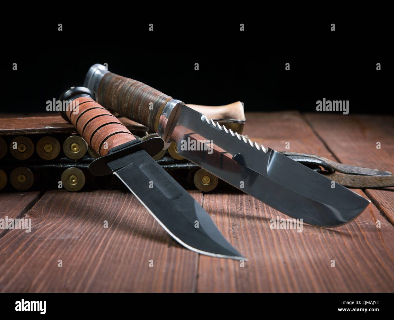 Still life with a knife and bandolier on a close-up table Stock Photo