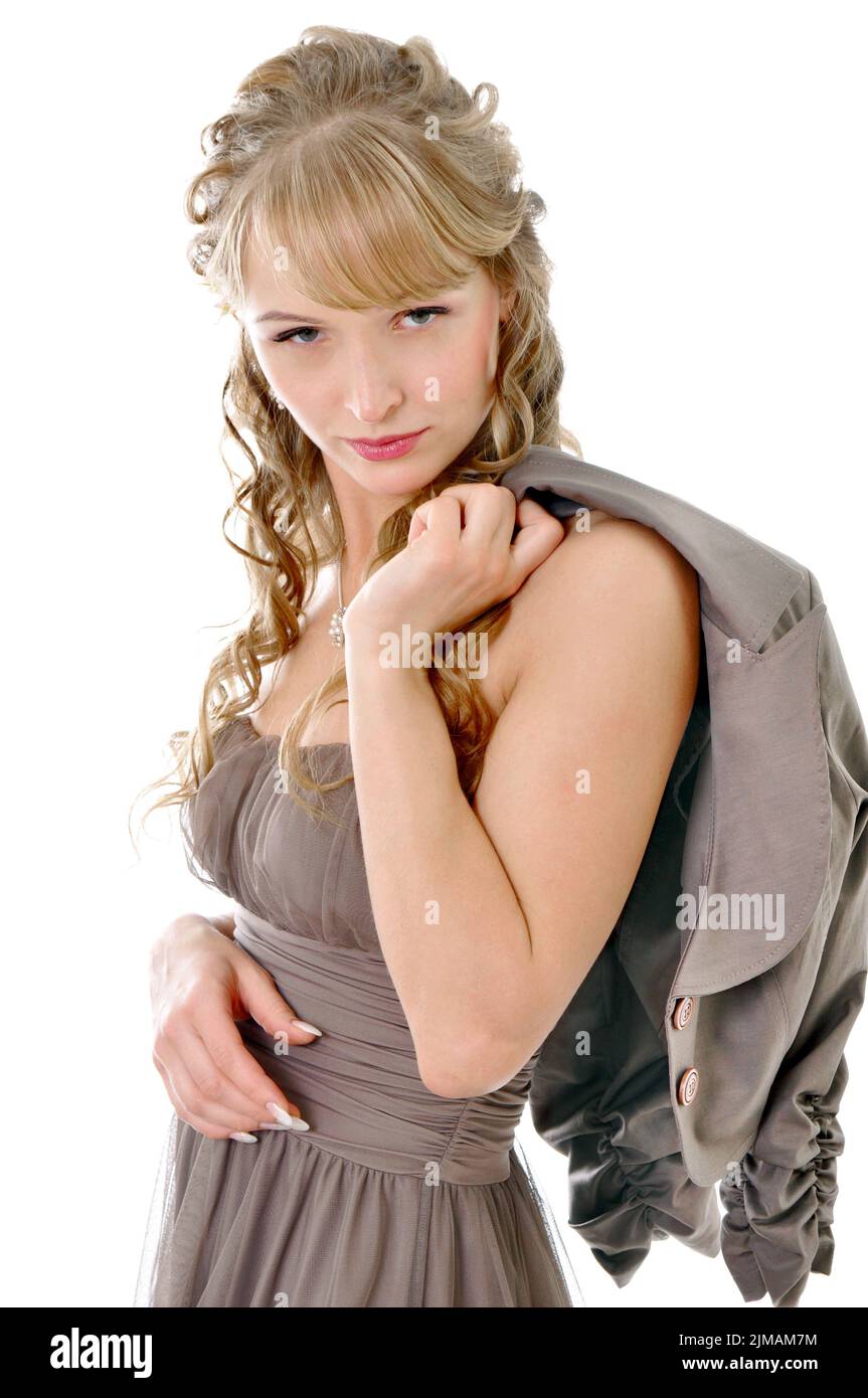 Girl with a jacket and dress with bare shoulders on a white background Stock Photo