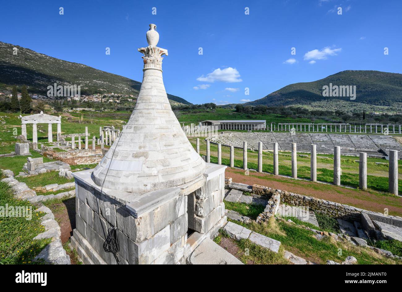 A 3rd cen. BC  grave monument  with a conical roof sits above the stadium, at Ancient Messene, Messinia, Peloponnese, Greece Stock Photo