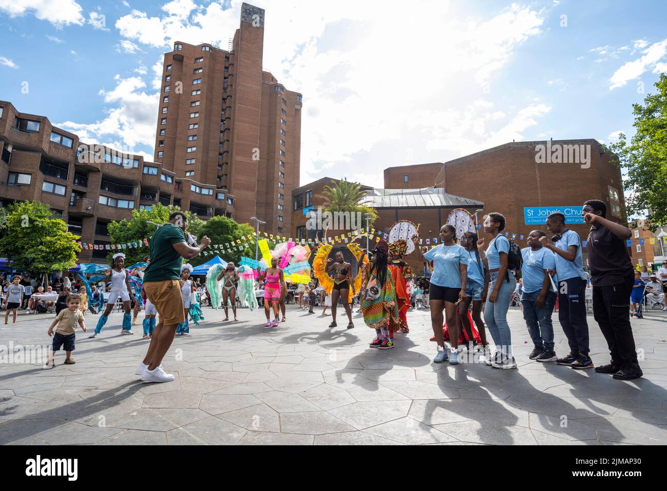 London, UK.  5 August 2022. Rapper TriniBoi Joocie (L) performs at Carnival in Chelsea, an event showcasing carnival costumes, music and culture.  The show is outside The Chelsea Theatre and is part of this year’s Kensington & Chelsea Festival. Credit: Stephen Chung / Alamy Live News Stock Photo