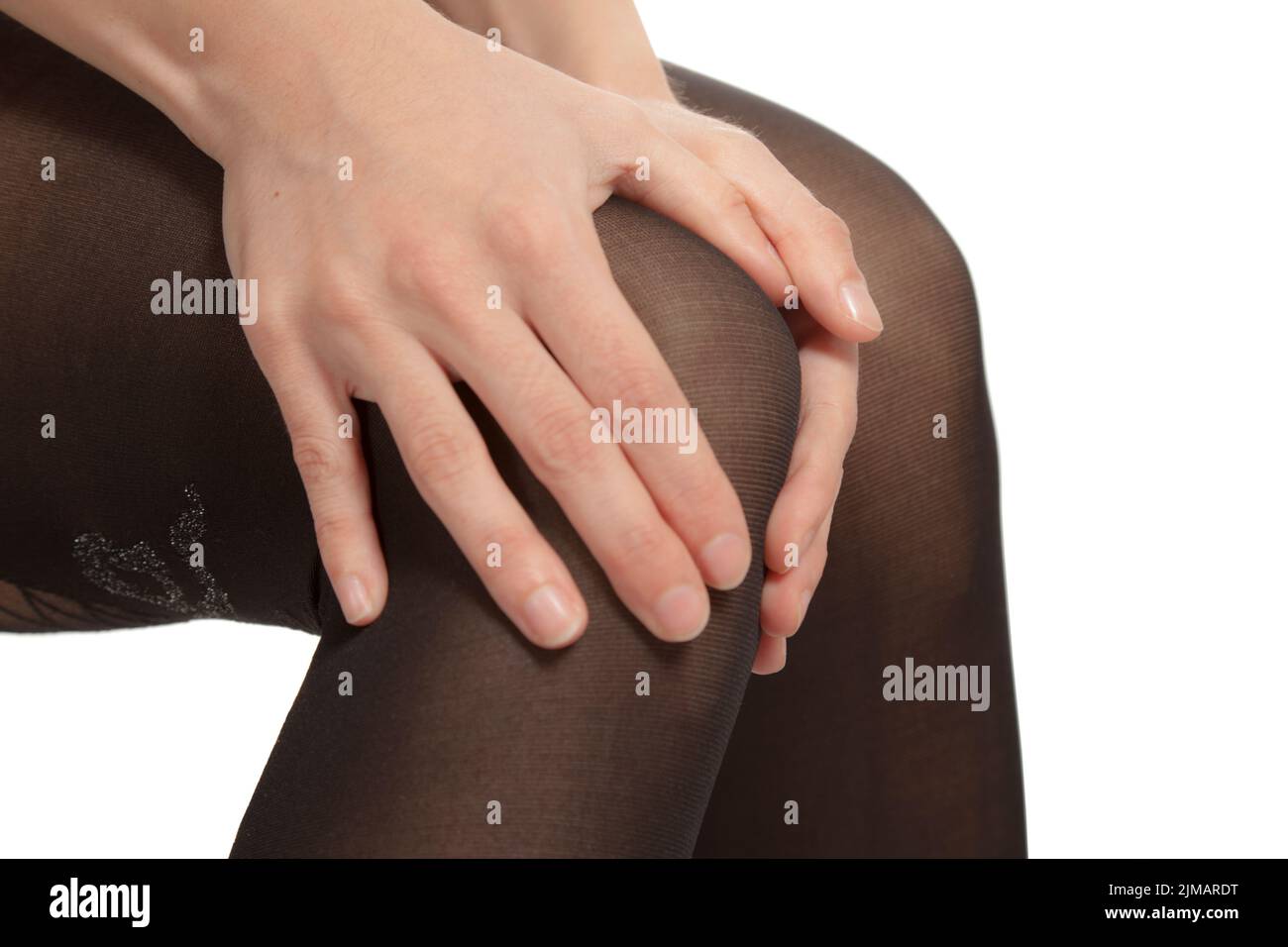 Female Knee Pain Holding Stock Photo