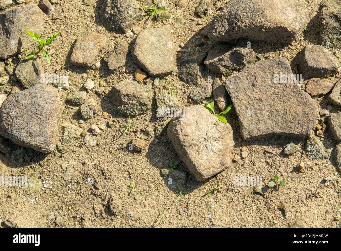 North Yorkshire, UK. 5th August, 2022. Dirt, stones and bare ground of the empty basin of Lindley Wood Reservoir. It is used by Yorkshire Water to supply drinking water to Leeds and surrounding areas, is nearly empty and dry. Credit: Bradley Taylor / Alamy News Stock Photo