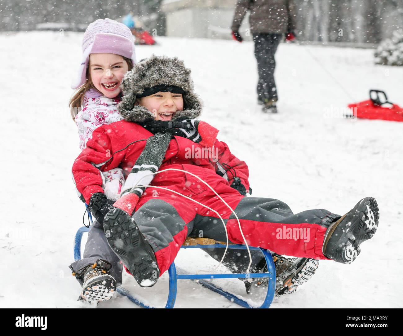 Kids Sledding Fun Snow Stock Photo