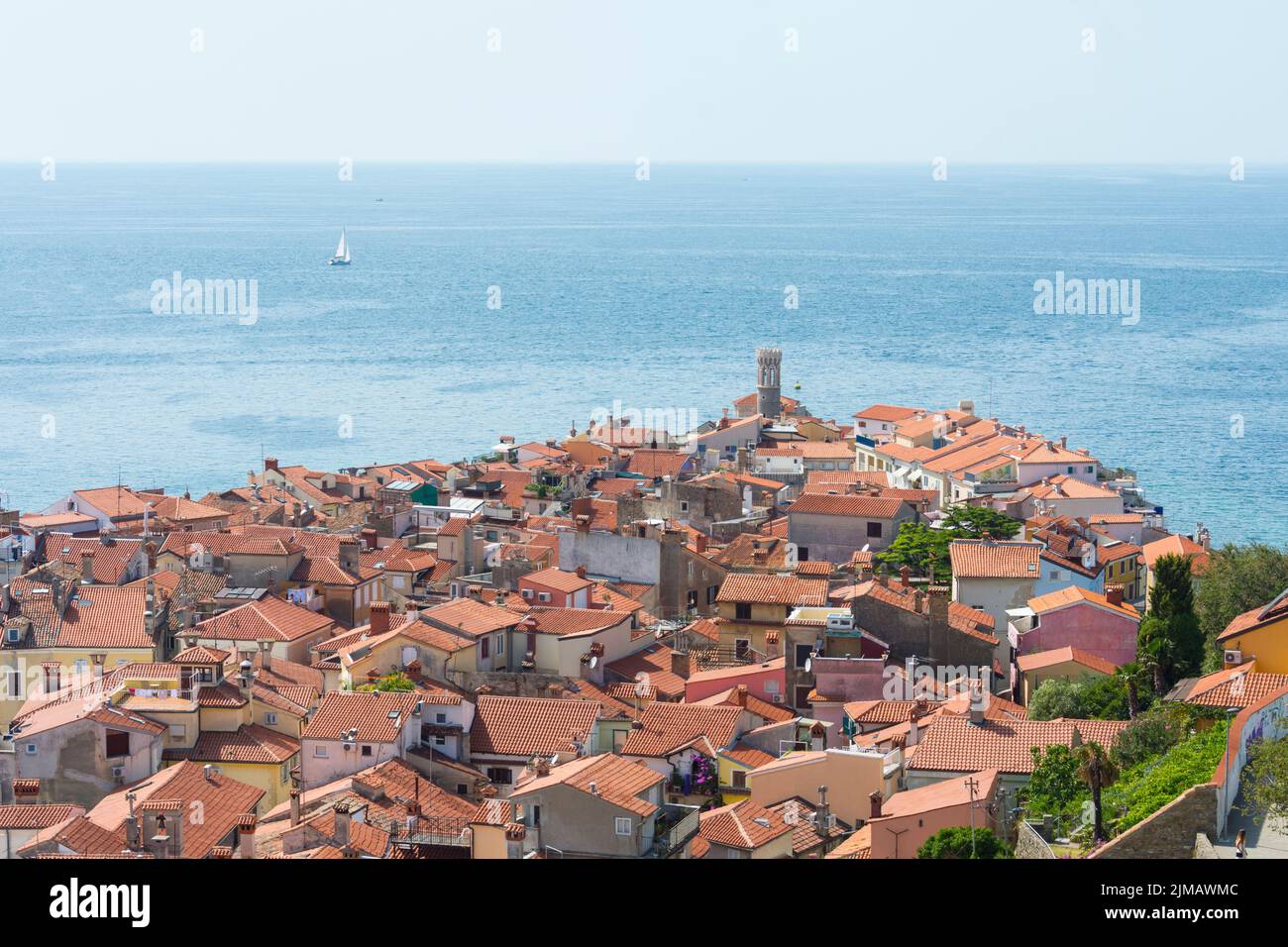 Red roofs of Piran and Adriatic see seen from St. George's Cathedral. Piran, Slovenia. Stock Photo