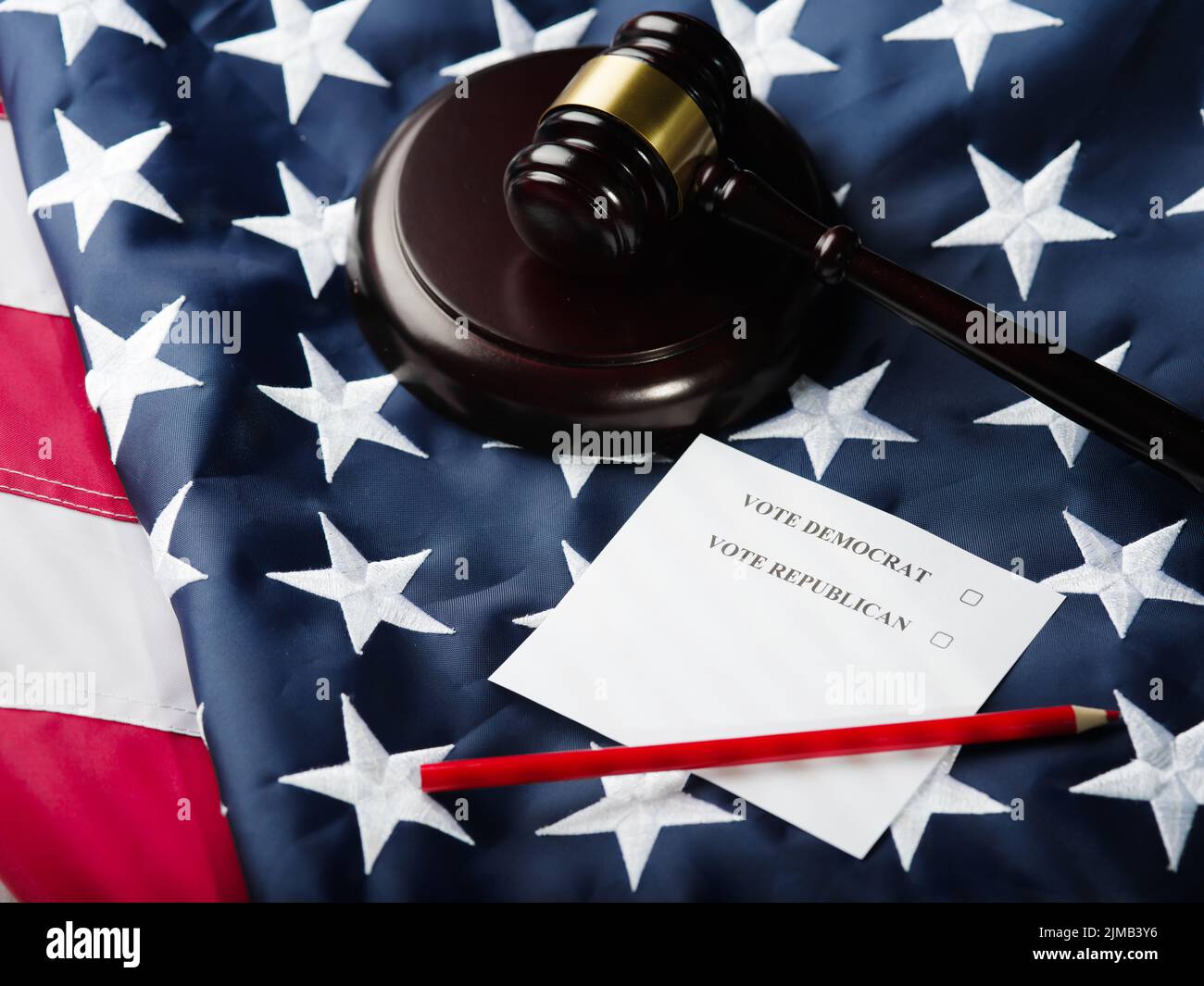 Elections, voting. Vote Democrat, Vote Republican - inscriptions on sheets of paper, a wooden gavel of a judge against the background of the state Ame Stock Photo