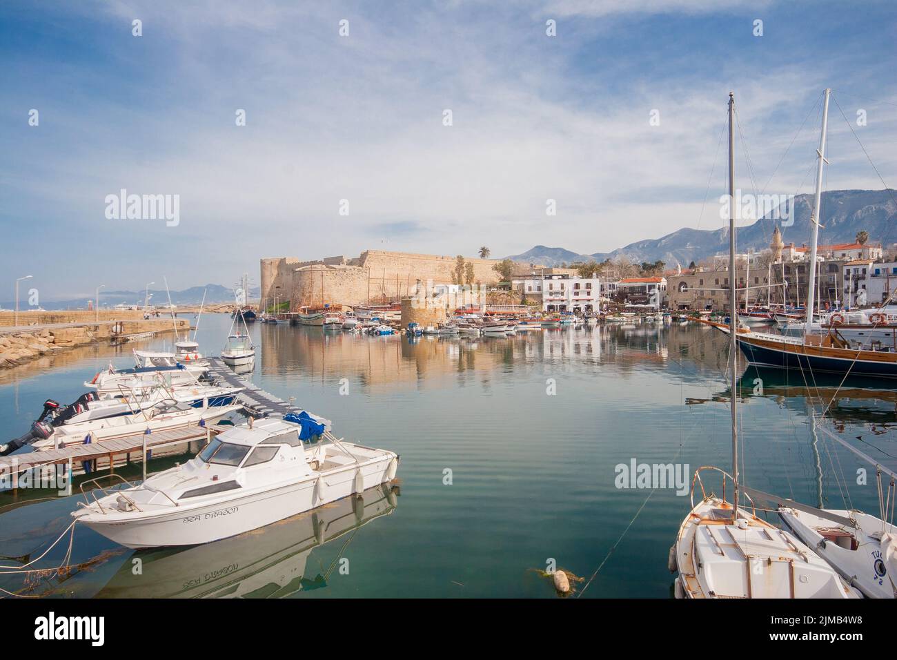 Old harbour of  Kyrenia, island of Cyprus, with boats and lighthouse in view Stock Photo
