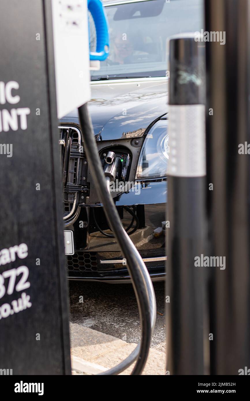 A vertical shot of a ESB Charging Station, with Black Cab electric
