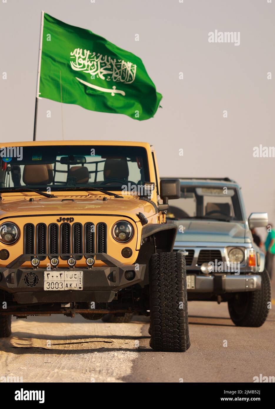 A vertical shot of Jeep riding through the desert to Asfar Lake in
