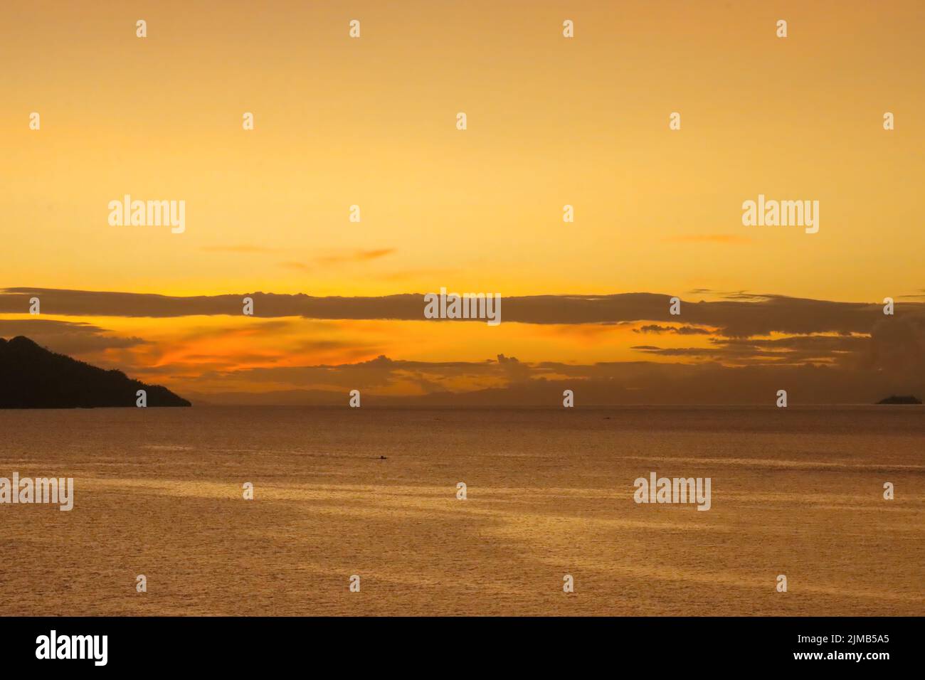 A beautiful orange sunset in the Philippines Stock Photo - Alamy