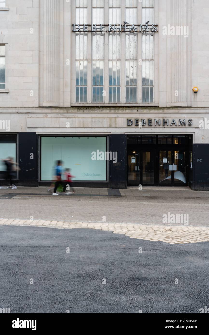 A vertical shot of closed down Debenhams department store on the high street, Plymouth, UK Stock Photo
