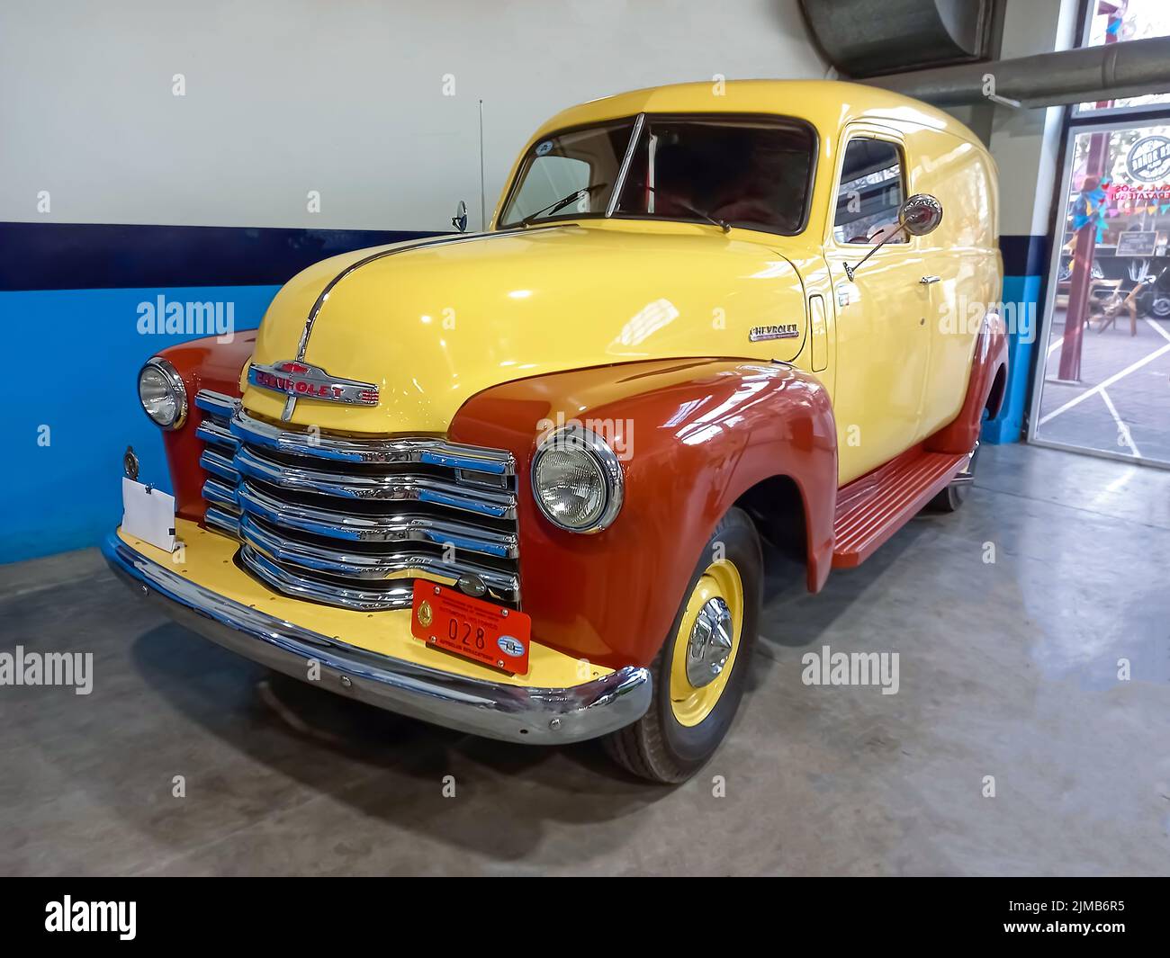 Berazategui, Argentina - Jul 22, 2022: Shot of an old cream and brown 1947 Chevrolet Chevy delivery panel van. Classic car show Stock Photo