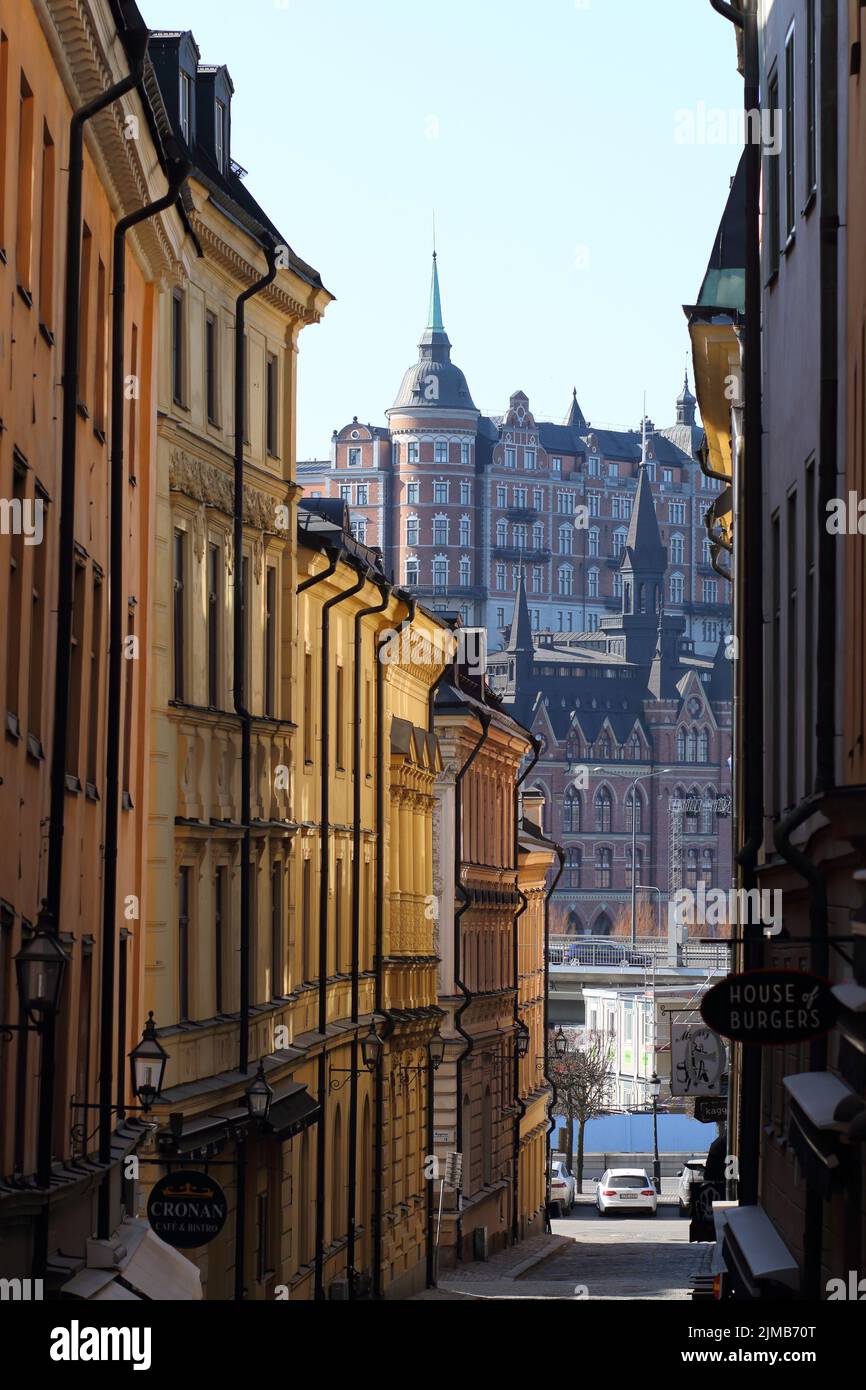 A vertical shot of a narrow street between old buildings in Stockholm ...
