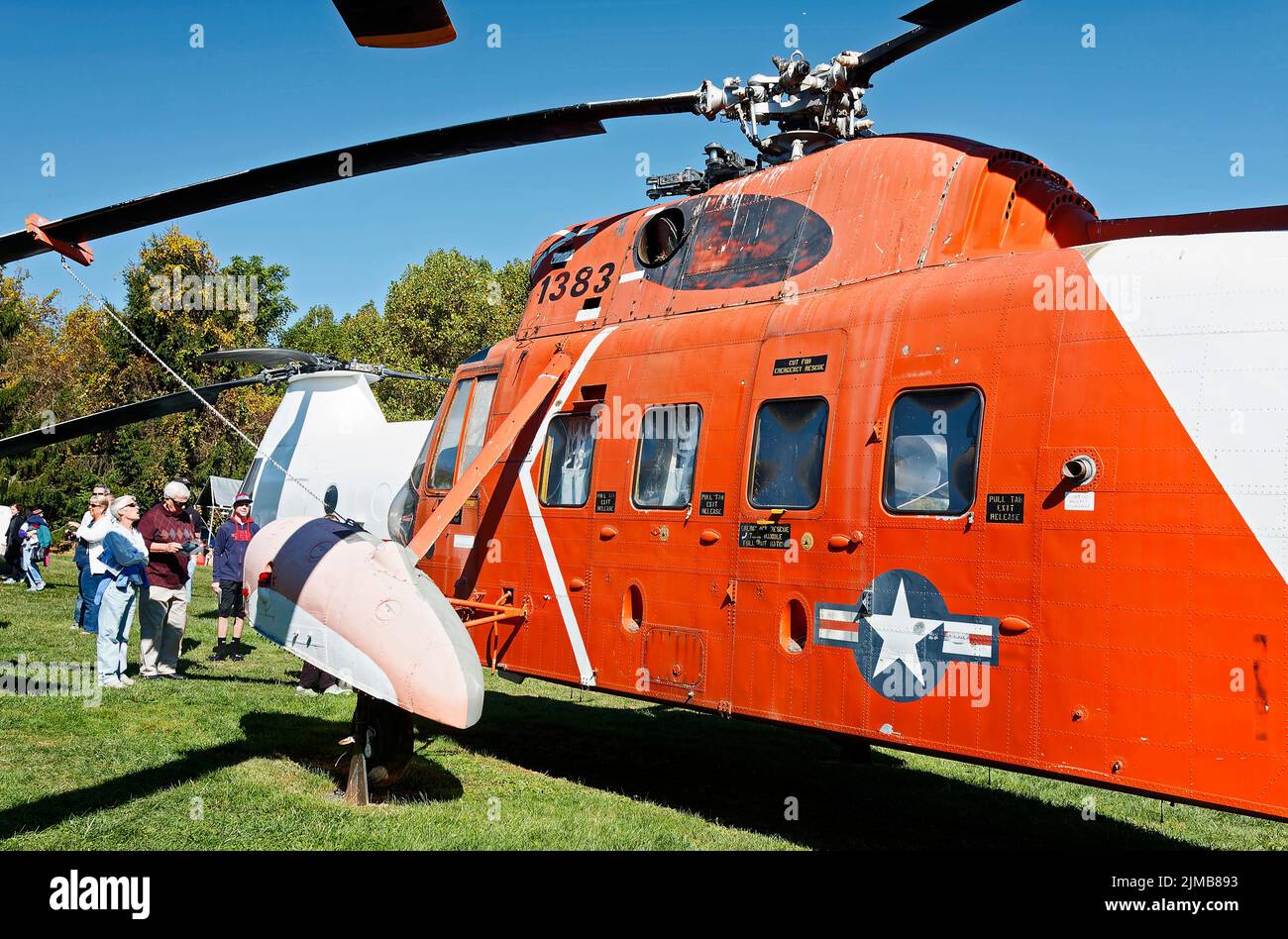 large helicopter, vintage, orange color, visitors looking, outdoors, aircraft, military, transportation, Helicopter Museum; Pennsylvania; West Chester Stock Photo