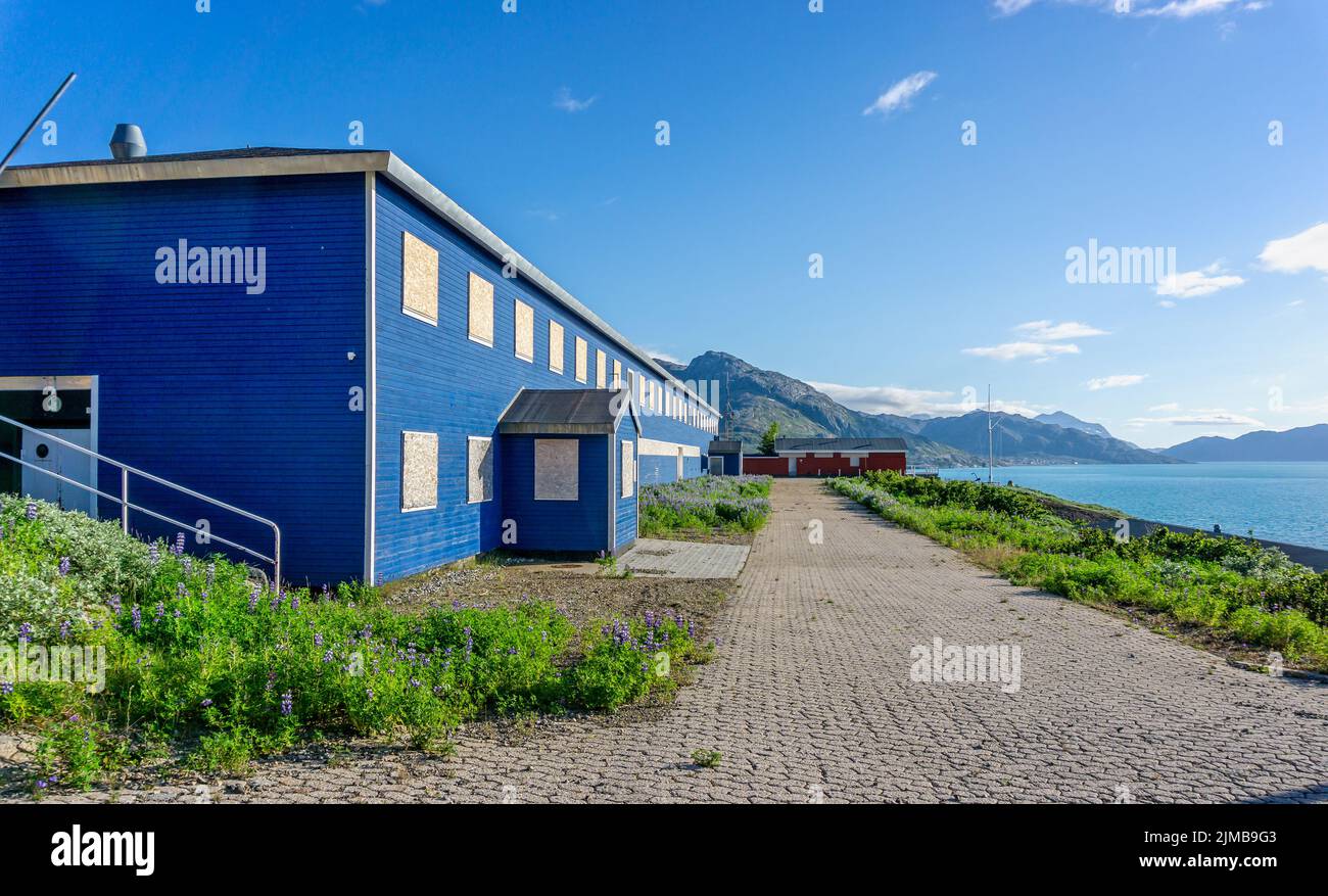 Boarded up blue building at the small Danish military base at Grondalen, West Greenland on 21 July 2022 Stock Photo
