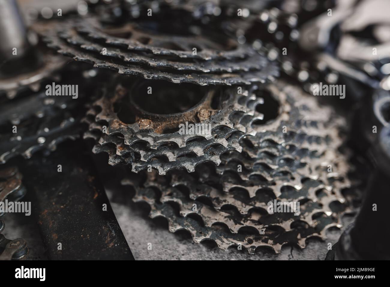 Worn mountain bike components chain rings cassette and chain Stock Photo Alamy