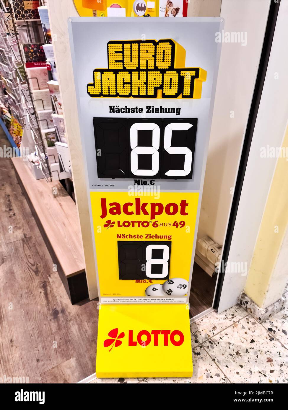 A vertical shot of a Euro Lottery display in a lottery ticket office with the winning amount Stock Photo