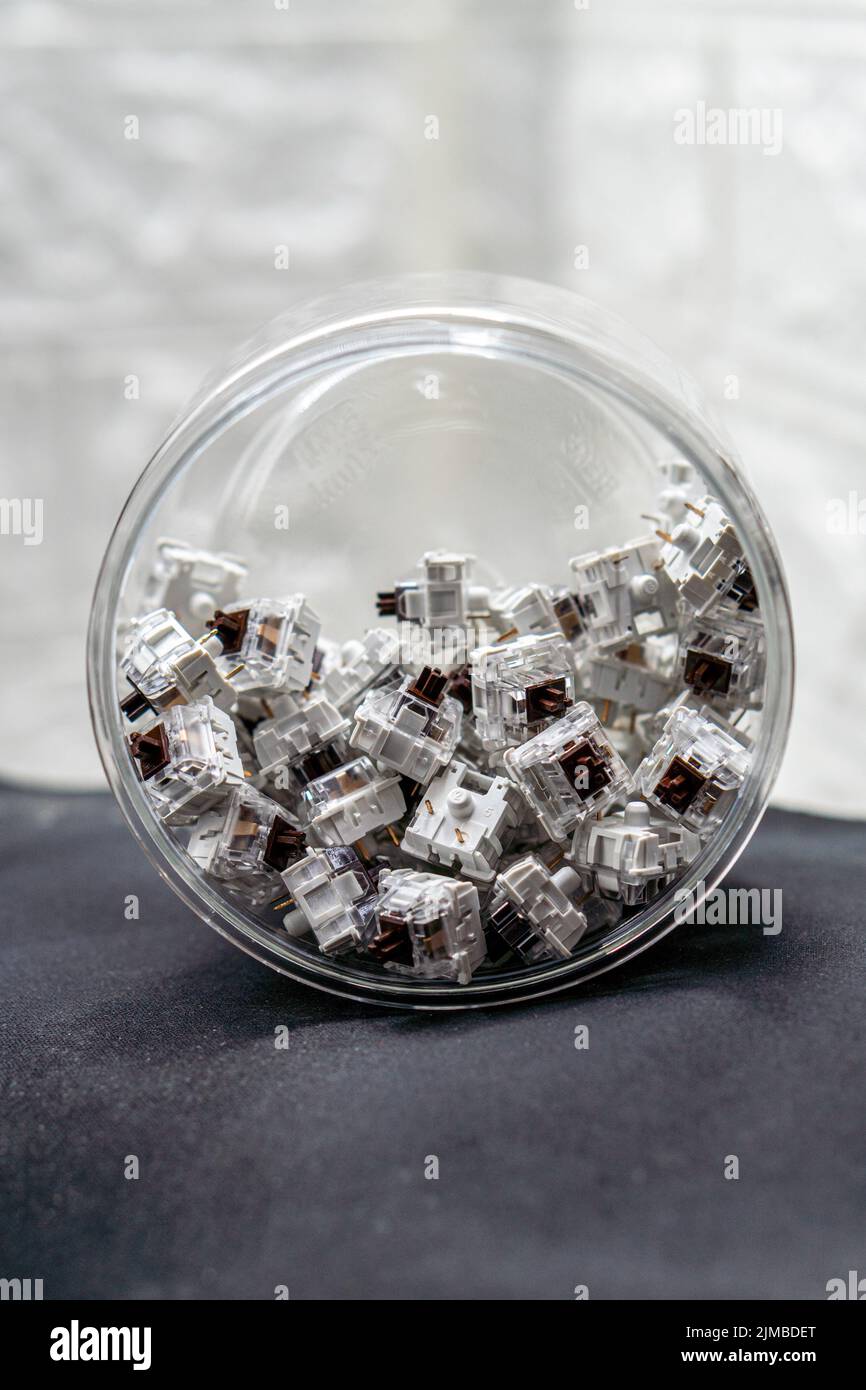 A vertical closeup of mechanical keyboard switches piled in a