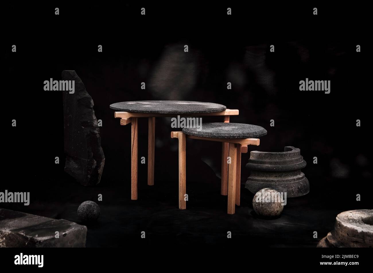 Designer coffee tables with wooden legs and a granite surface Stock