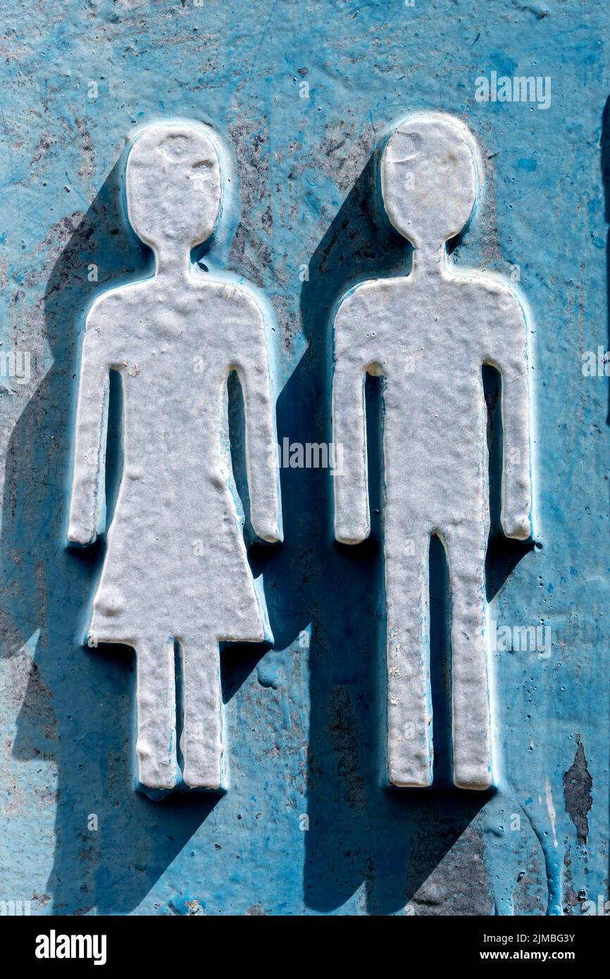 Metallic voluminous painted with oil paint old toilet signs Stock Photo