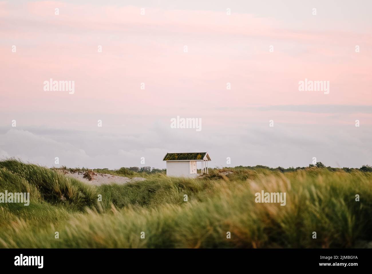 A white beach hut on Skanor beach in Falsterbo, Skane, Sweden Stock ...