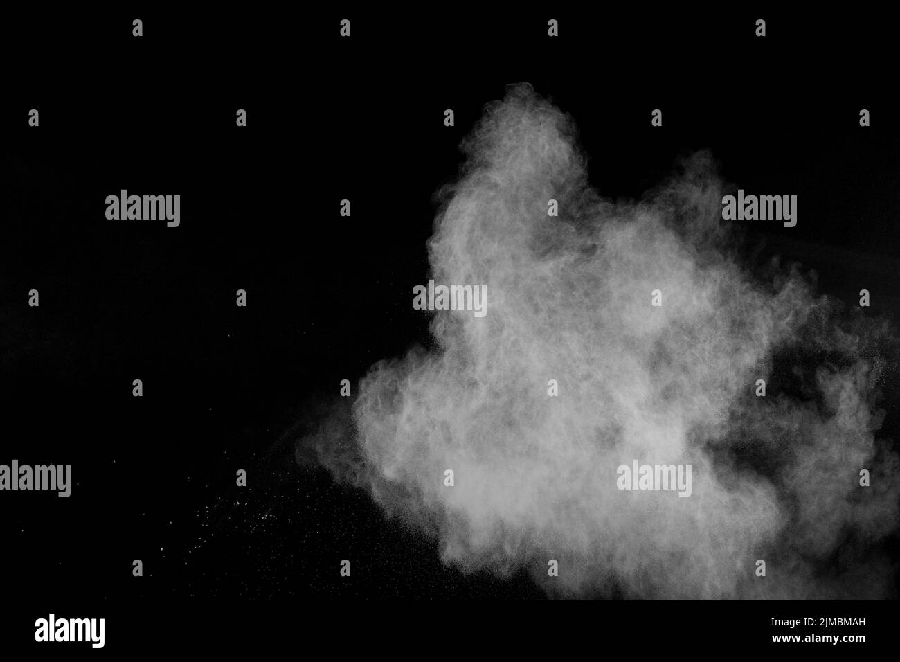 Abstract white powder explosion against black background.Abstract white dust exhale. Stock Photo