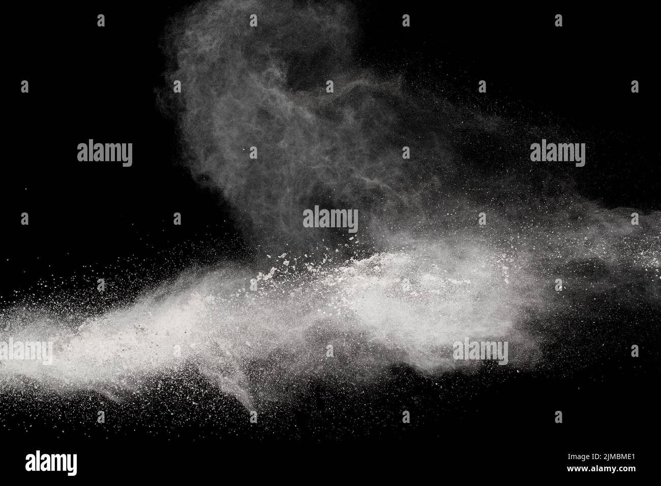 Bizarre forms of white powder explosion cloud against black background