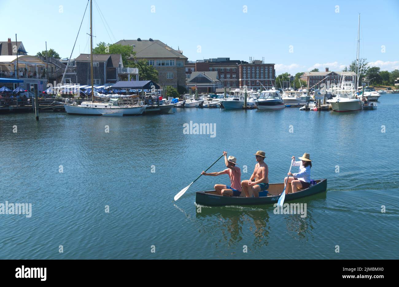 Canoeing across Eel Pond inlet in Woods Hole, Massachusetts on Cape Cod, USA Stock Photo
