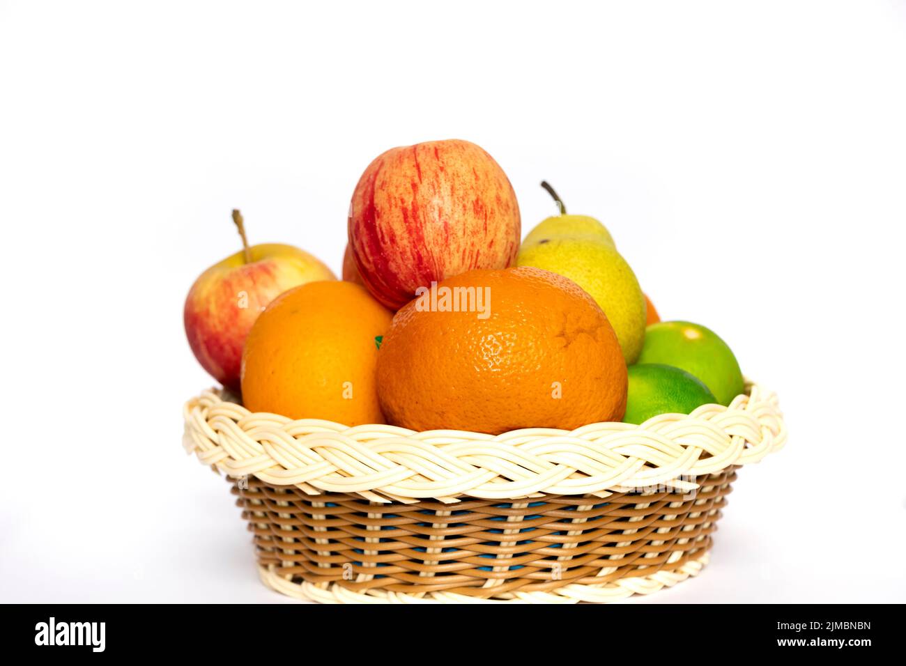 Closeup Image Of Tasty Fruits In Wooden Basket. Background White Stock Photo