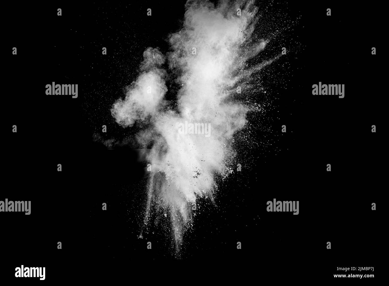 White powder explosion isolated on black background. White dust ...