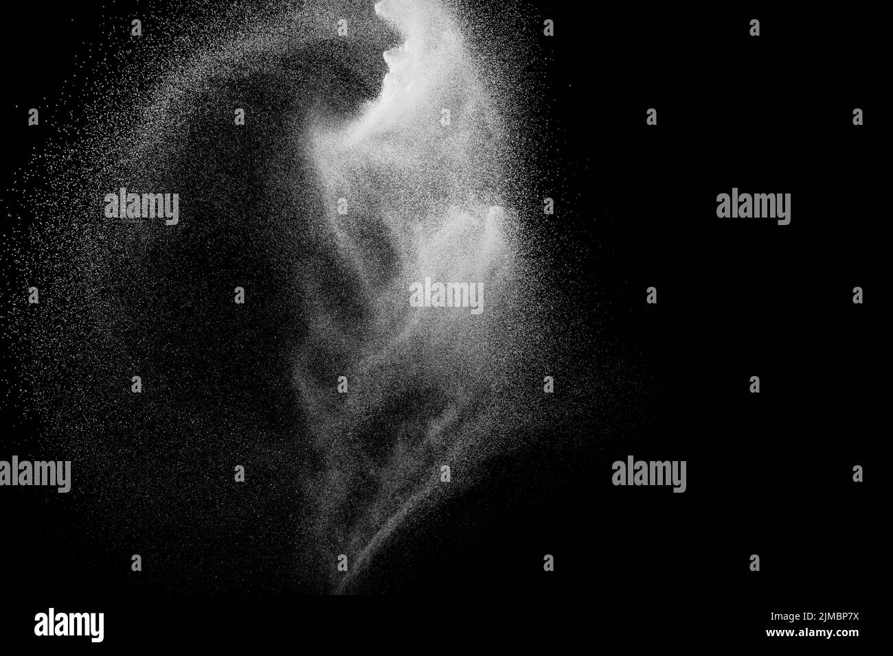 White powder explosion isolated on black background. White dust