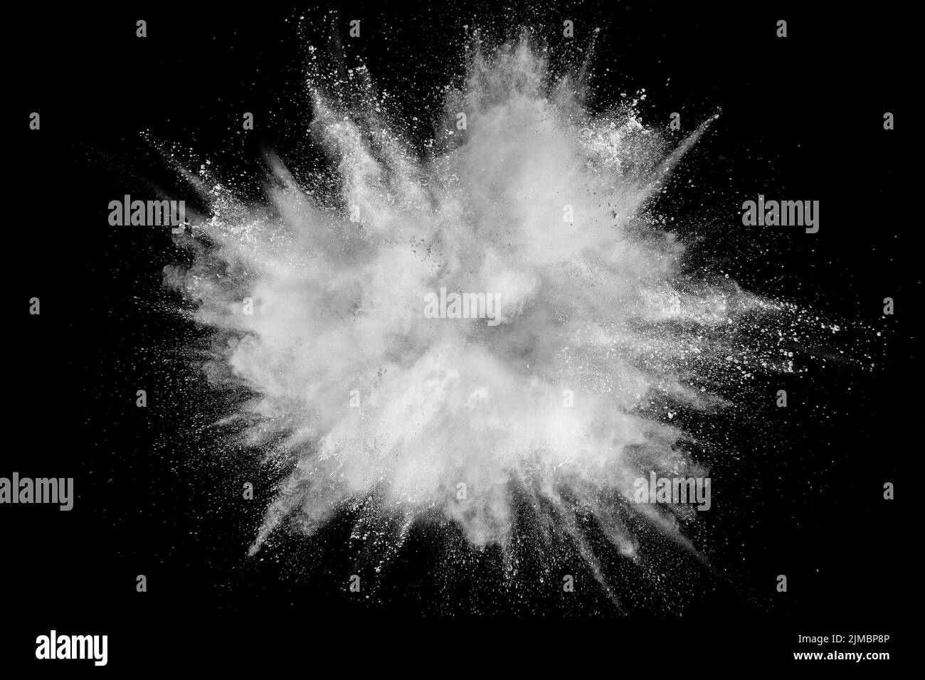 White powder explosion isolated on black background. White dust