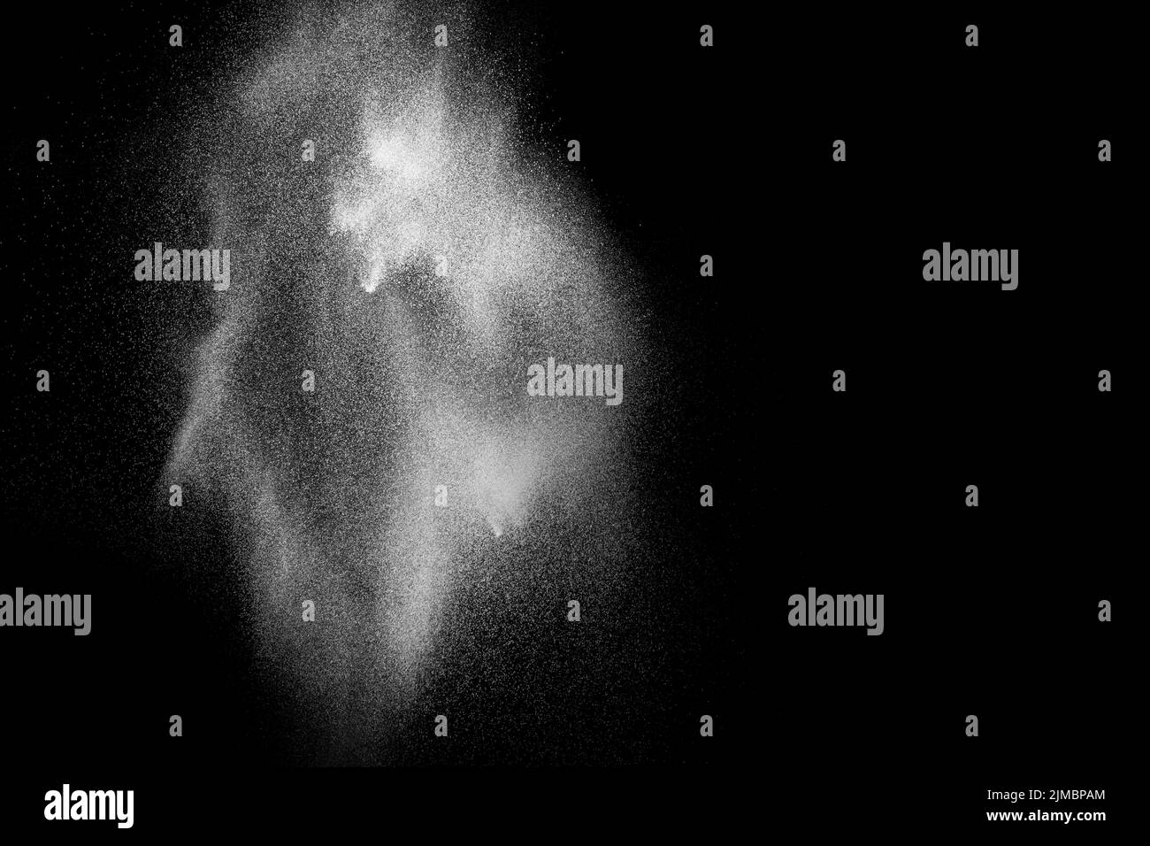 White powder explosion isolated on black background. White dust ...