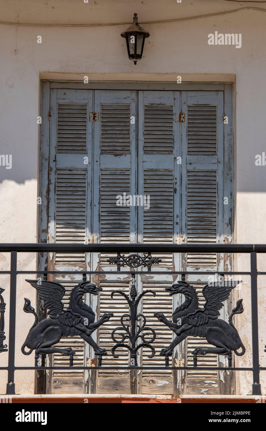 ornate cast iron railings on a typically greek building on the island ...