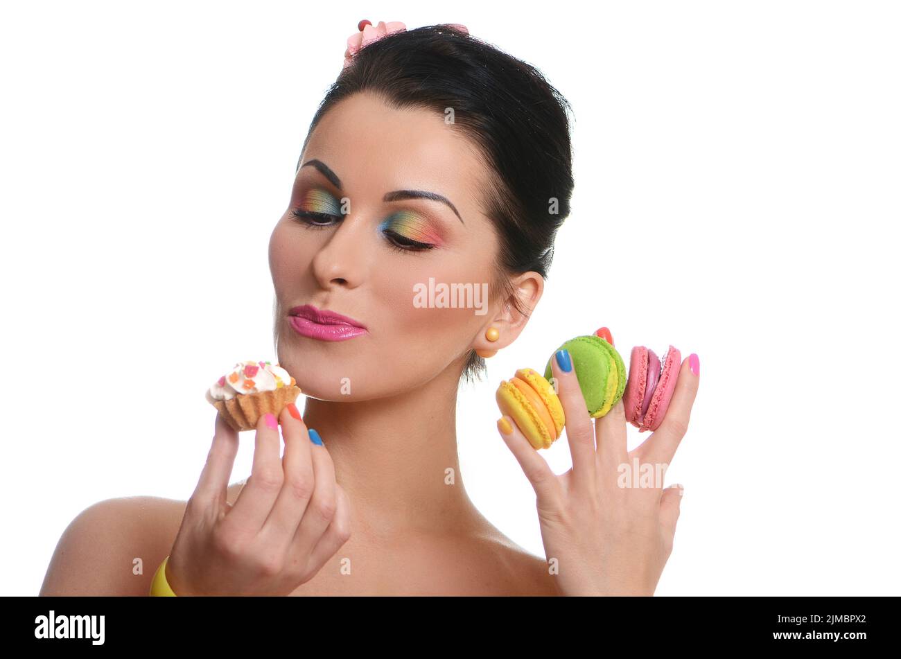 Beauty fashion model girl taking colorful cakes Stock Photo Alamy