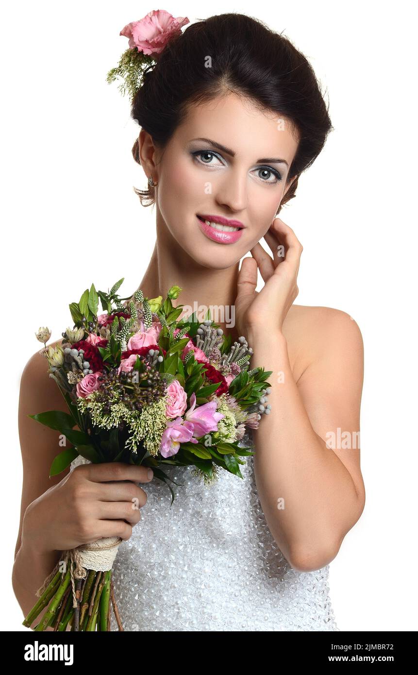 Studio portrait of a young beautiful bride with a wedding bouquet Stock ...