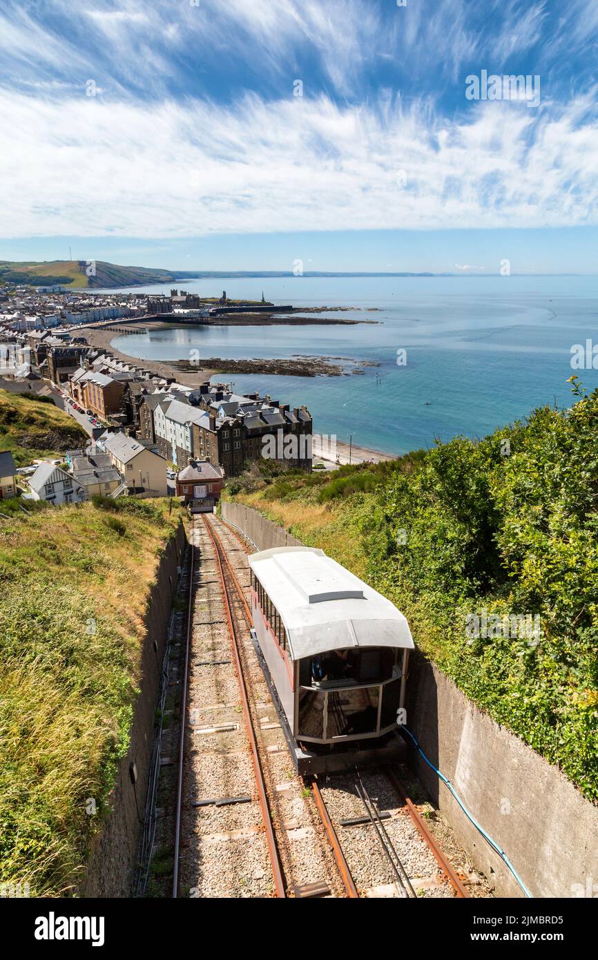Looking down the funicular track of the cliff railway on Constitution Hill to Cardigan Bay and the seaside university town of Aberystwyth, Wales, UK. Stock Photo