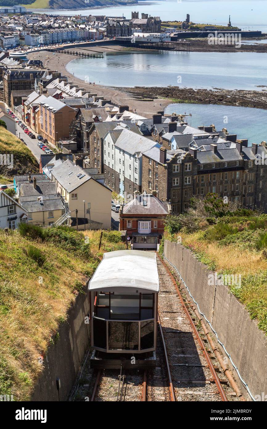 Looking down the funicular track of the cliff railway on Constitution Hill to Cardigan Bay and the seaside university town of Aberystwyth, Wales, UK. Stock Photo