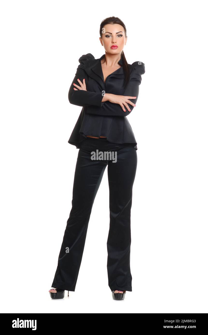 Portrait of a confident young woman standing isolated on white ...