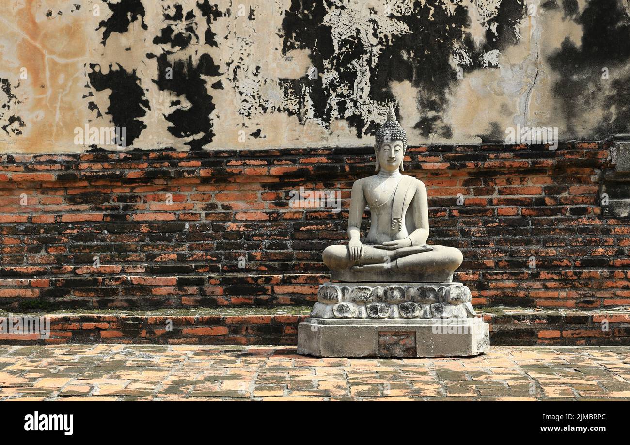 Buddha statue background with old ruins of ancient building Stock Photo ...