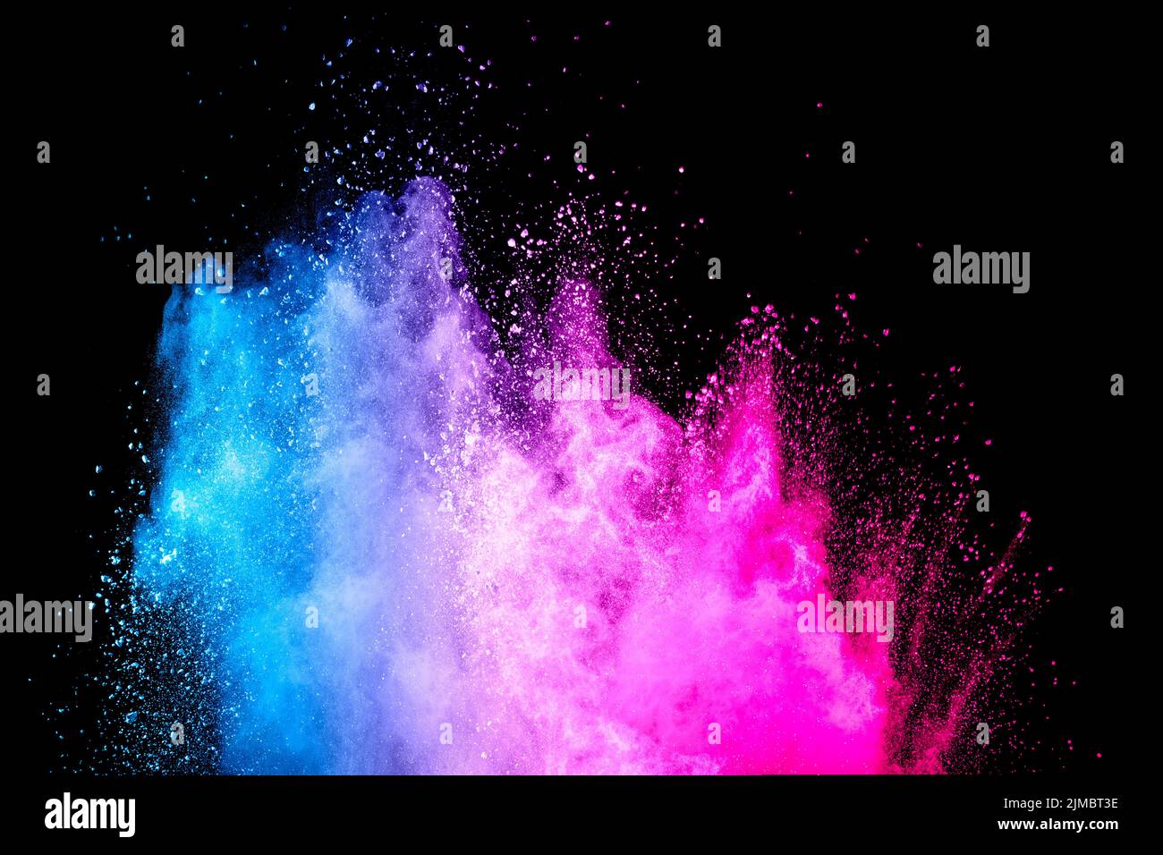 Blue pink powder explosion on black background Stock Photo - Alamy