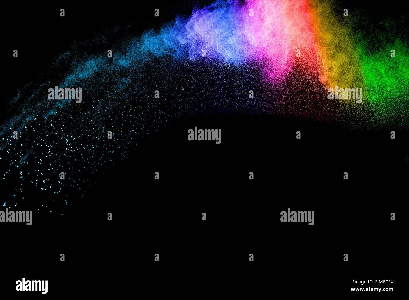 Abstract color powder explosion on black background.Freeze motion of ...
