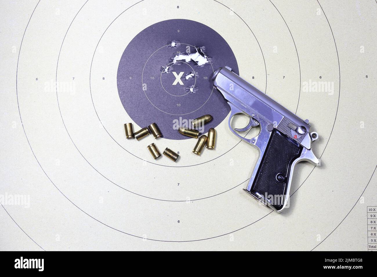 Gun and shooting target With Bullet Holes. Classic Paper Shooting